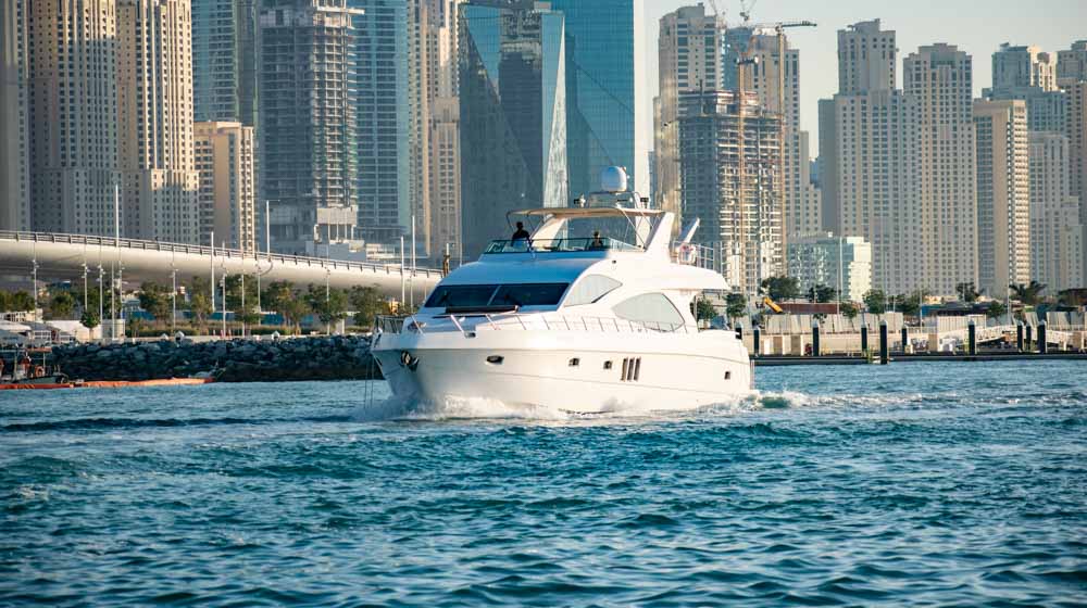 big yacht cruising near Dubai Marina Harbour